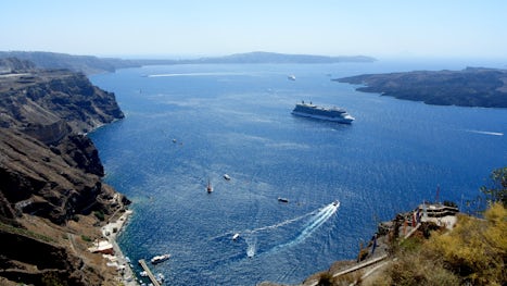 Celebrity Equinox is waiting for passengers in Santorini bay. Amazing view from Fira!