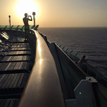A friend taking a photo on the ship at sunset