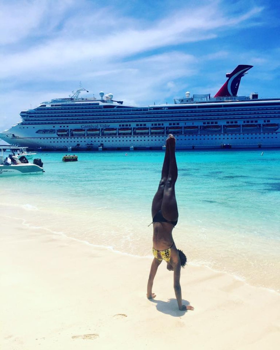 My daughter proving she still can do a hand stand from her cheer competition days!! This is in Grand Turks