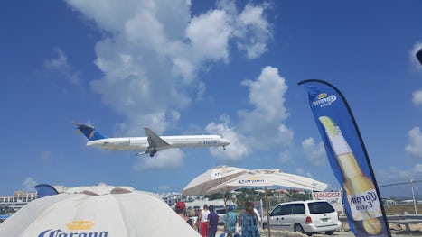Plane landing over Sunset bar and grill in St maarten