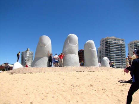 The Dedos (fingers) rising out of the sand on a beach in Punta del Este