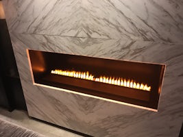 A fireplace on a river/ocean vessel? Very clever technique of combining lig