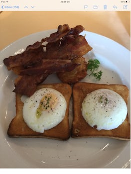 Breakfast, poached eggs on toast, and crispy bacon