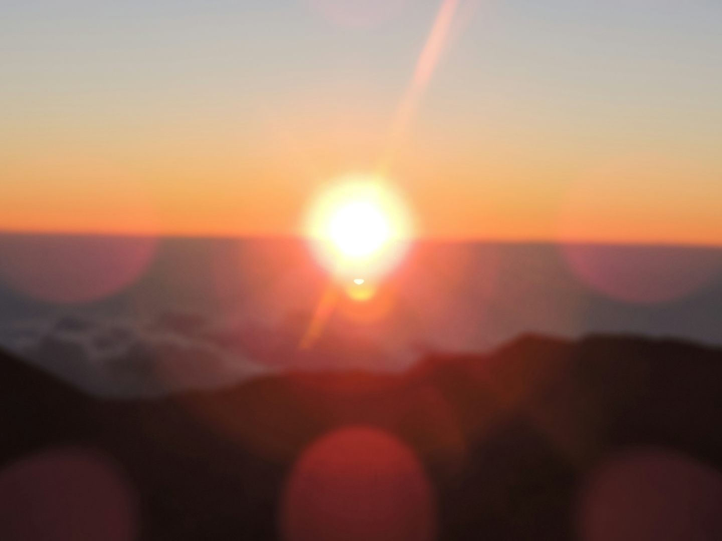 Sunrise at Haleakala, 10,000 ft. Dress warm; it was 38* that morning and it