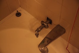 damaged fixtures in tub area