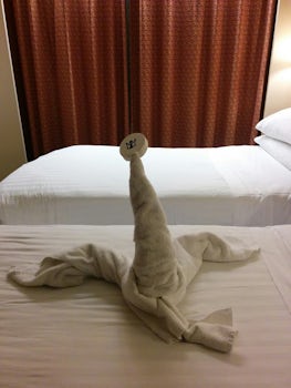 Towel art.  Not sure but it might be a seal?