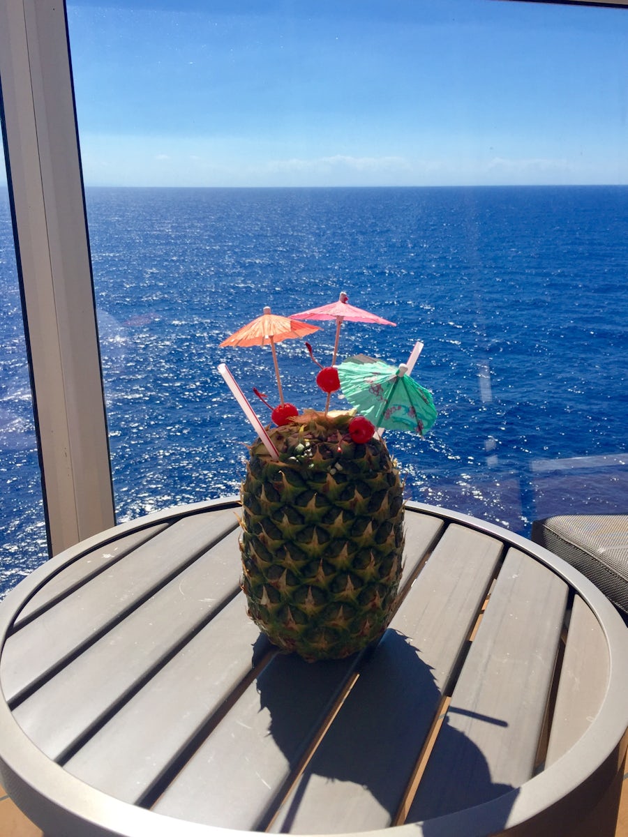 Balcony of cabin with drink in pineapple