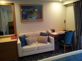 The dressing table, sofa and desk in the Balcony Stateroom.