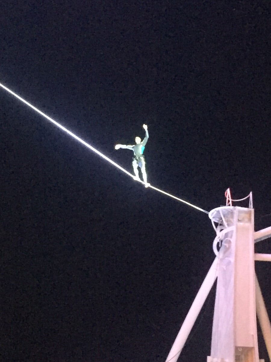 Aqua Show - tightrope walker high above the audience
