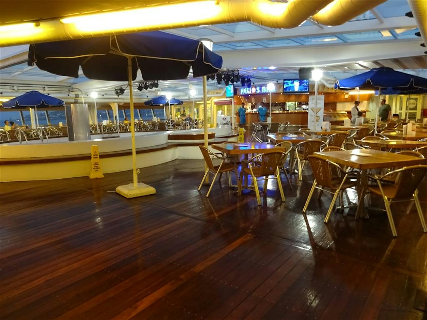 Pool area midships with Helios Bar.  Deck 9 Leda Buffet restaurant adjacent