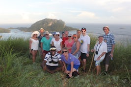 Our hiking group near Ratu Namasi school with a peek of the boat in the bac