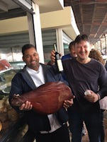 Head Chef Eddie buys a leg of smoked prosciutto while the store keeper reco