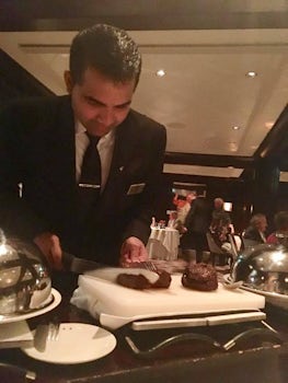Waiter serving Chateaubriand for two in Murano.