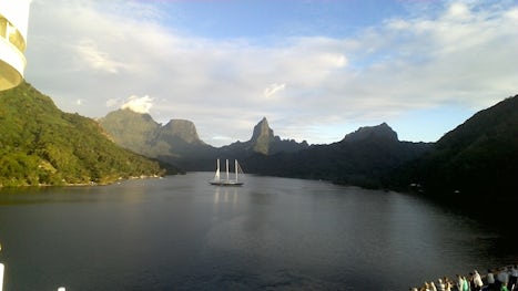 Our anchorage at Moorea.  Crystal clear water, soaring mountains and 100 shades of lush green hill sides.