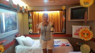 Our stateroom with an ocean view and two twin beds. They also offered decor
