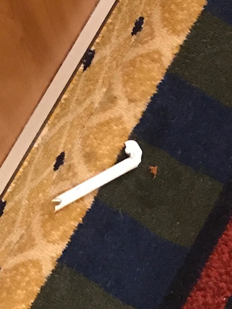 Broken lighting tube discarded in corridor