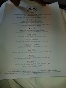 Personalized Chef's Table menu for the 7-course dinner.