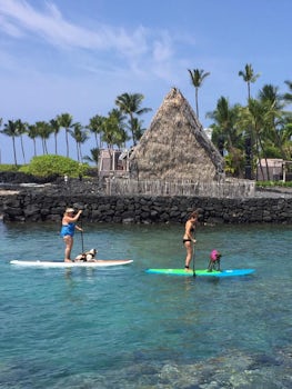 Paddle boarding in front of Aheuna Heiau