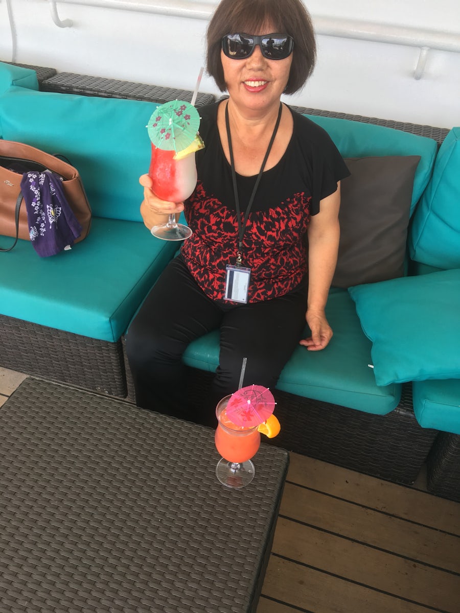 The wife enjoying a Tropical Drink on deck aboard the Carnival Valor.