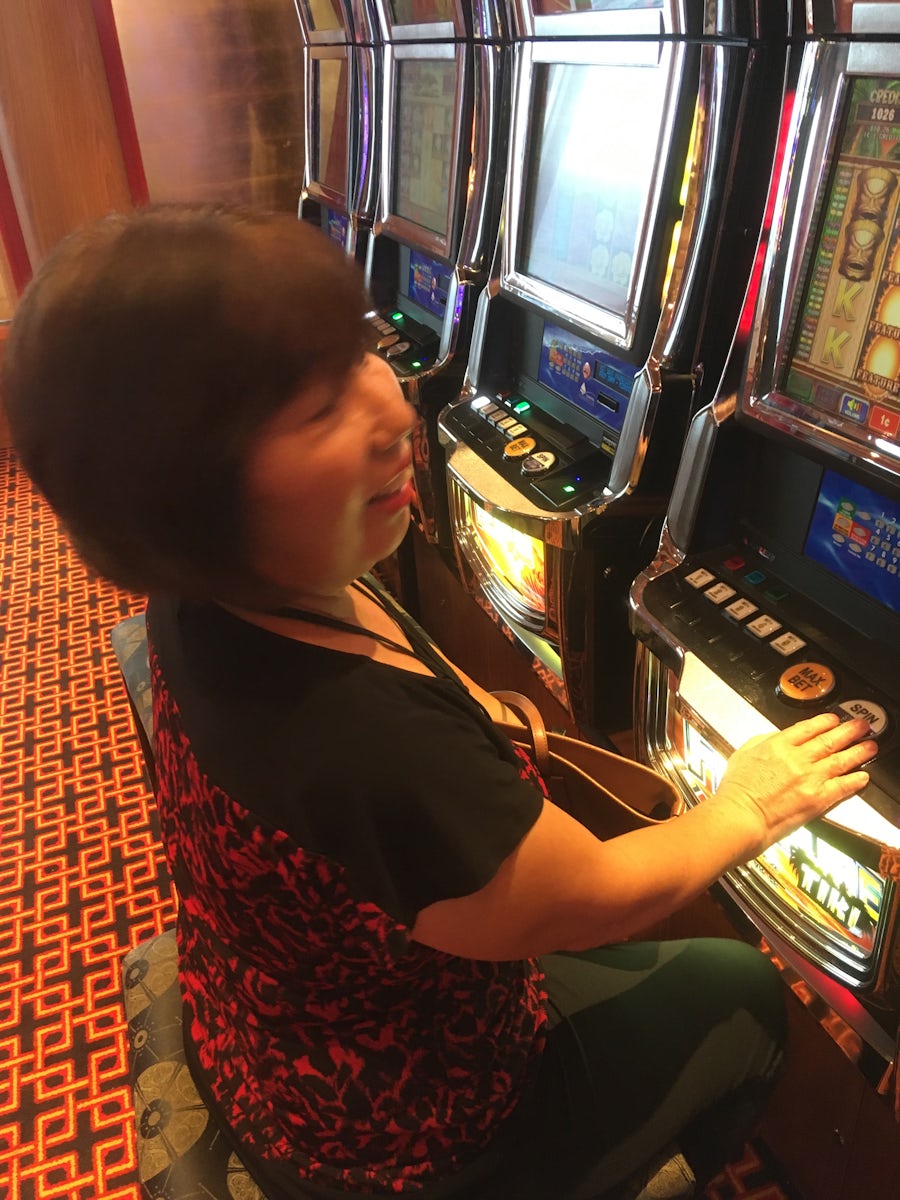 The wife playing the Slot Machines aboard the Carnival Valor and having a b