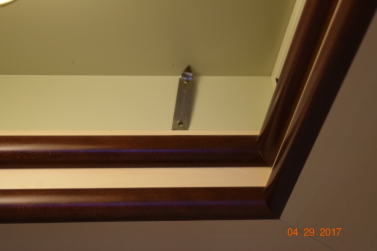 Bottle opener installed by prior cruiser in light fixture to stop rattle.