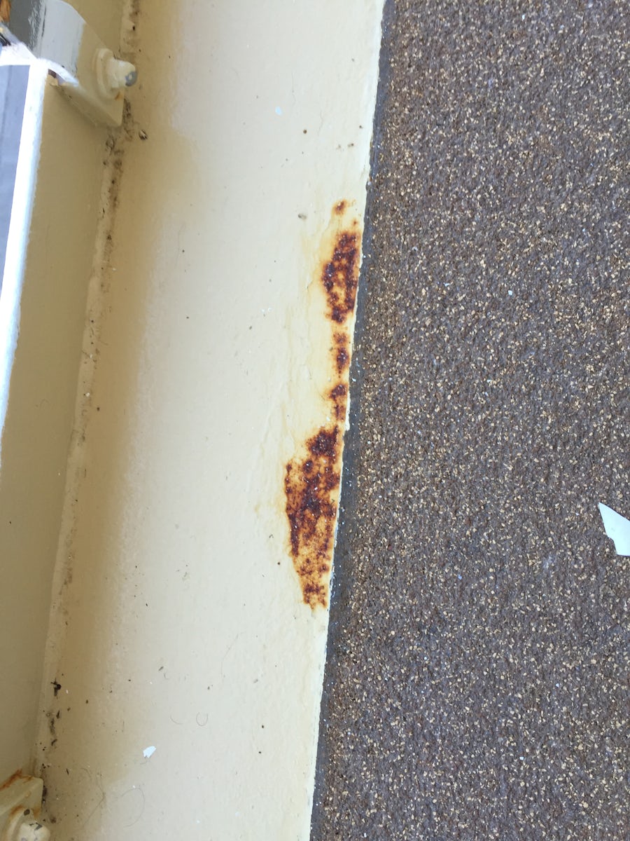 Three areas of rust on the balcony.
