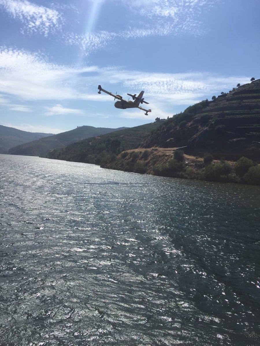 Firefighting Plane landing on the Douro River next to our ship to scoop up