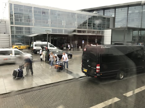 Sitting by the airport in the rain waiting, waiting, waiting hours for the Holland America Zuiderdam bus to take us to the port. Terrible system. Would never do their transfers again. Nightmare!