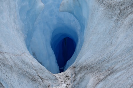 Helicopter Ride to Meade Glacier walk.  Close up of a crevasse.