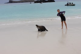 Young girl on our cruise is mimicking the sea lion that came to play