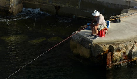 Fishing on quay, Valetta, Malta.
