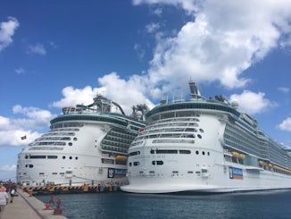 The Independence and its newly renovated sister ship, Liberty of the seas with a good view of the new water slides on the back of the ship.