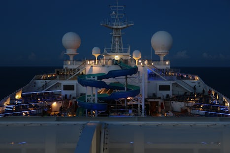 This is a night time photo of the slide located on the Lido deck