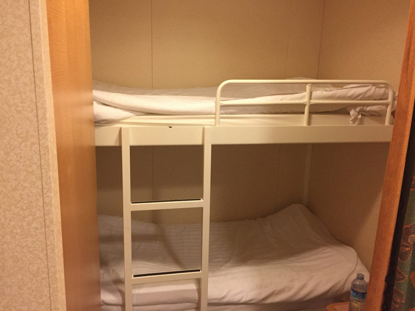 When you first walk in to the right small room with two bunk beds, closet, small table. Perfect for kids or smaller adults.
