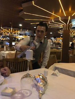 Our waiter, Jeffrey, displaying his balancing capabilities.