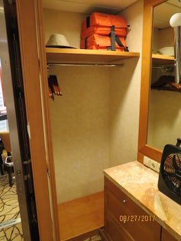Split closet with vanity in the middle.