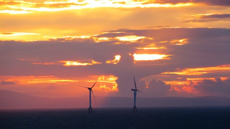 Wind turbines against the sunset, after leaving Invergordon.