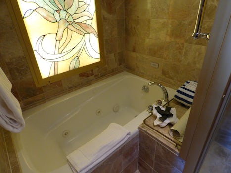 Spa bath next to shower