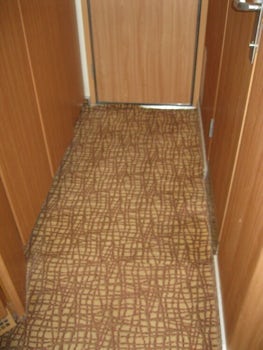 poorly installed carpet, potentialtripping hazard at door