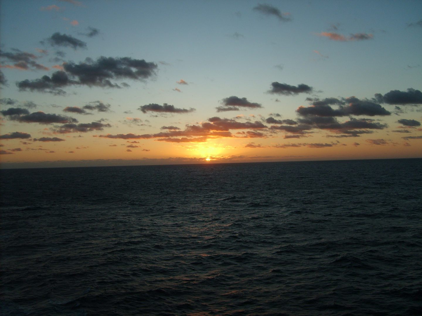 Sunrise off the bow of Grandeur of the Seas.