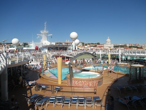 Deck 12 looking forward down onto deck 11 pools/whirlpools and pool and sky