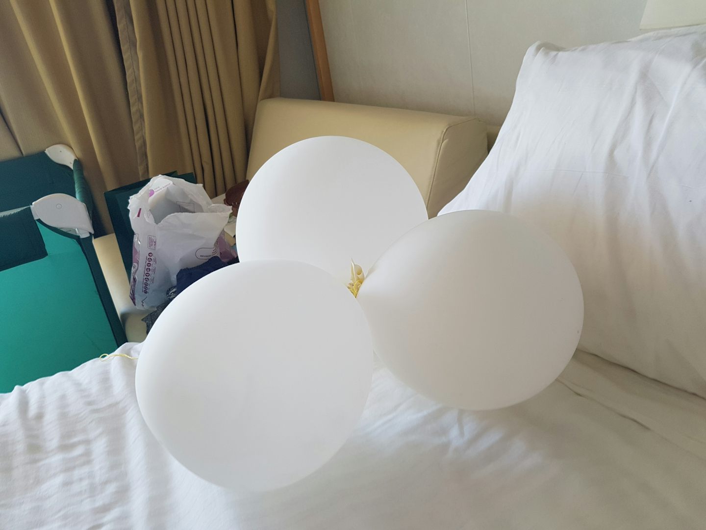 3 inflated balloons found under the bed from previous occupants