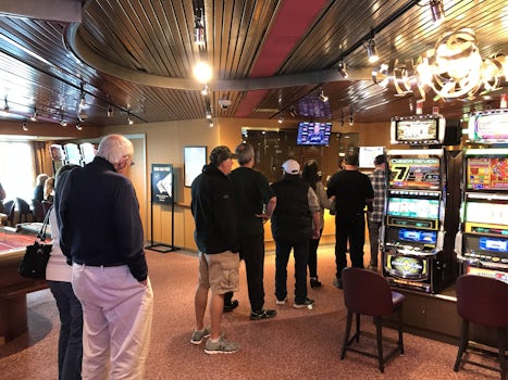 Long line at the casino cashier. Last day of the cruise and they staff the