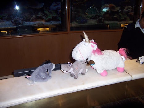 Eeyore and Petunia being greeted by Unicorn who lives at Guest Services