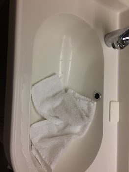 Washcloths (supposedly clean ones) in the sink instead of folded and placed