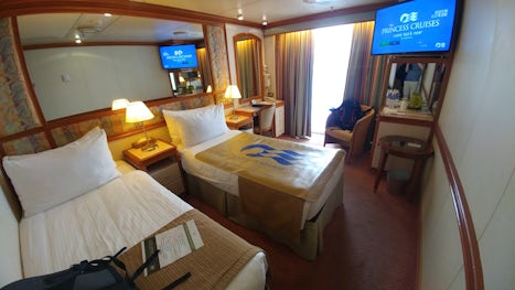 A regular balcony stateroom before third bunk bed deployed.