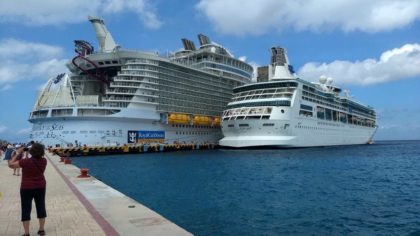 One of my favorite photos. Harmony of the Seas is moored next to Vision of