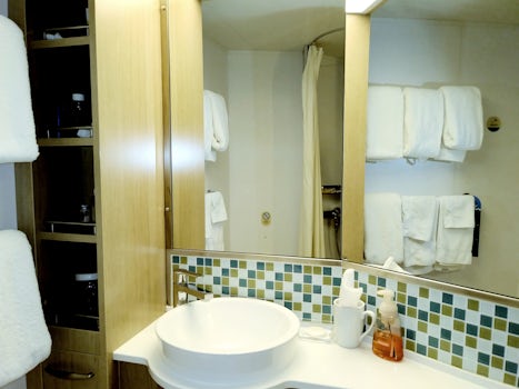 Updated bathroom with new vanity, sink, fixtures and cabinet.