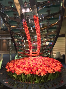 Flowers by the atrium glass staircase