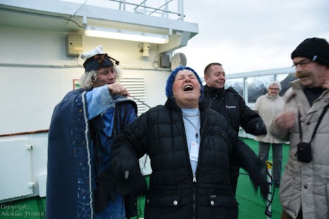 Crossing the Arctic Circle ceremony - I got ice and icy water down my bck!